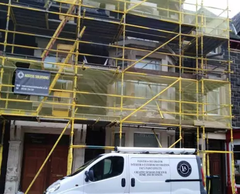 Exterior painting services Allsopp and Morgan Painting and Decorating Services image of van in front of scaffold